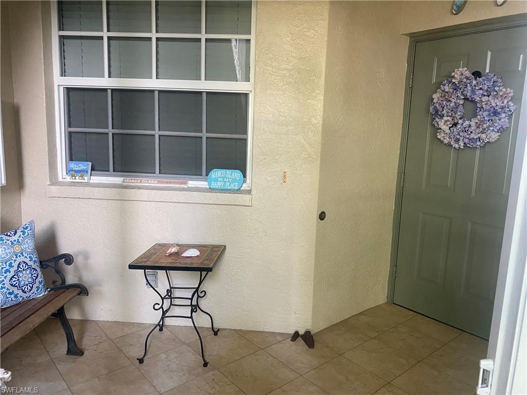 295 Waterside Circle, Unit 1102 Marco Island, FL 34145 - Photo 3 of 31 a view of workspace with wooden floor and cabinet