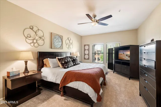 a bathroom with a granite countertop sink and a toilet