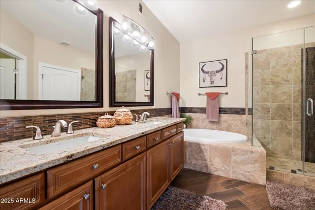 an outdoor living room with furniture and a floor to ceiling window