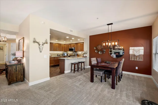 a kitchen with stainless steel appliances granite countertop a sink stove microwave and cabinets