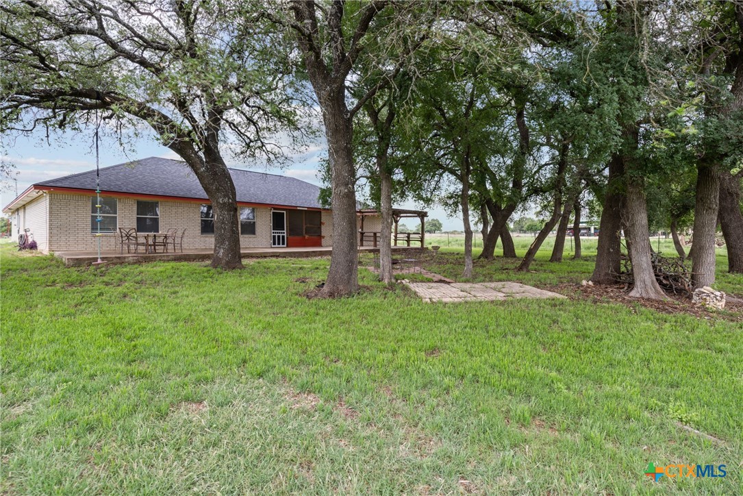 601 7 Ranch Road Salado, TX 76571 - Photo 11 of 44 a tree in front of a white house