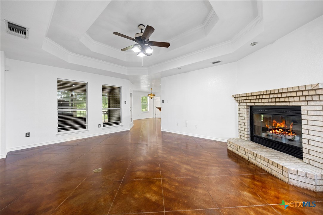 601 7 Ranch Road Salado, TX 76571 - Photo 16 of 44 a view of an empty room with window and fire place