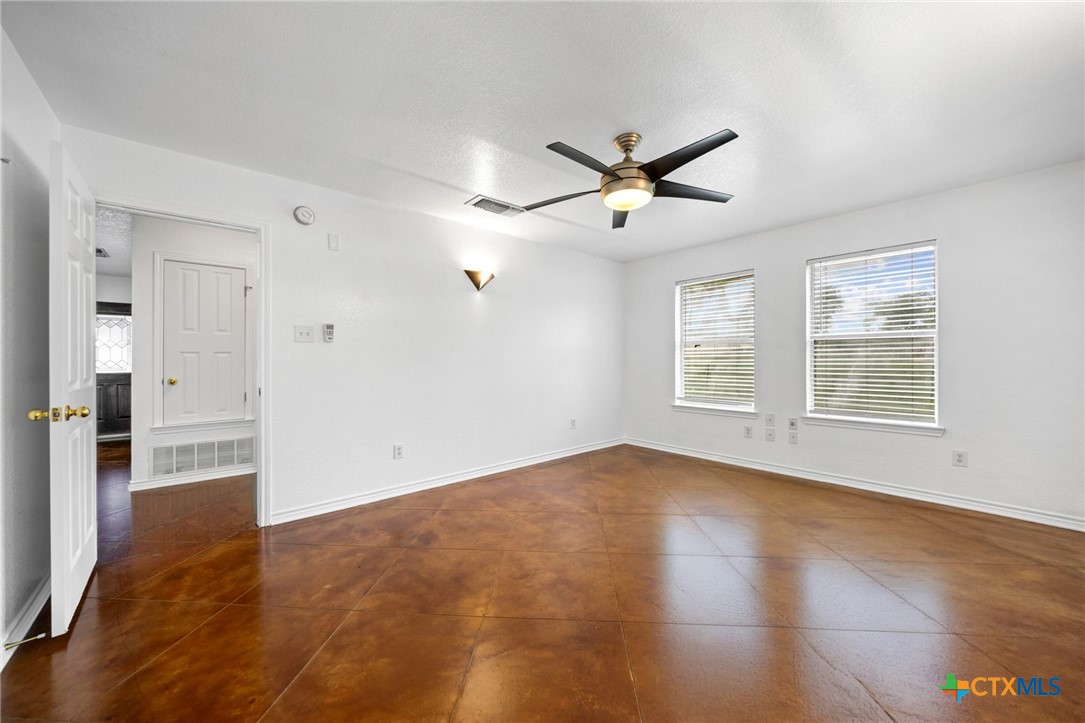 601 7 Ranch Road Salado, TX 76571 - Photo 30 of 44 a view of empty room with wooden floor and fan