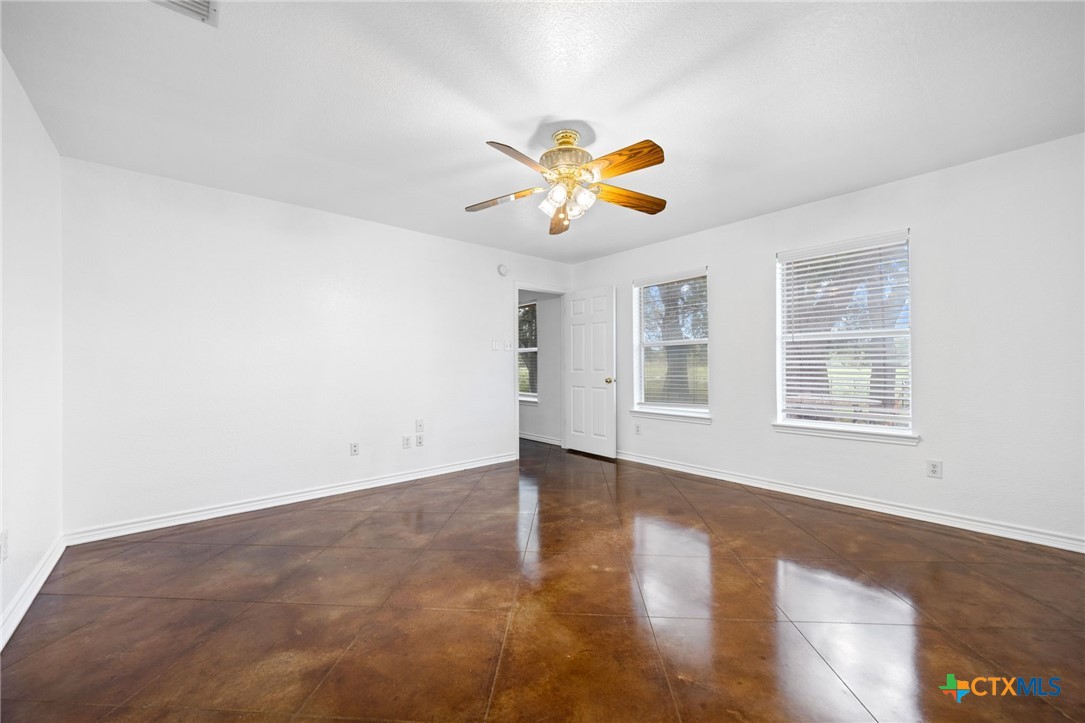 601 7 Ranch Road Salado, TX 76571 - Photo 36 of 44 a view of an empty room with window and wooden floor
