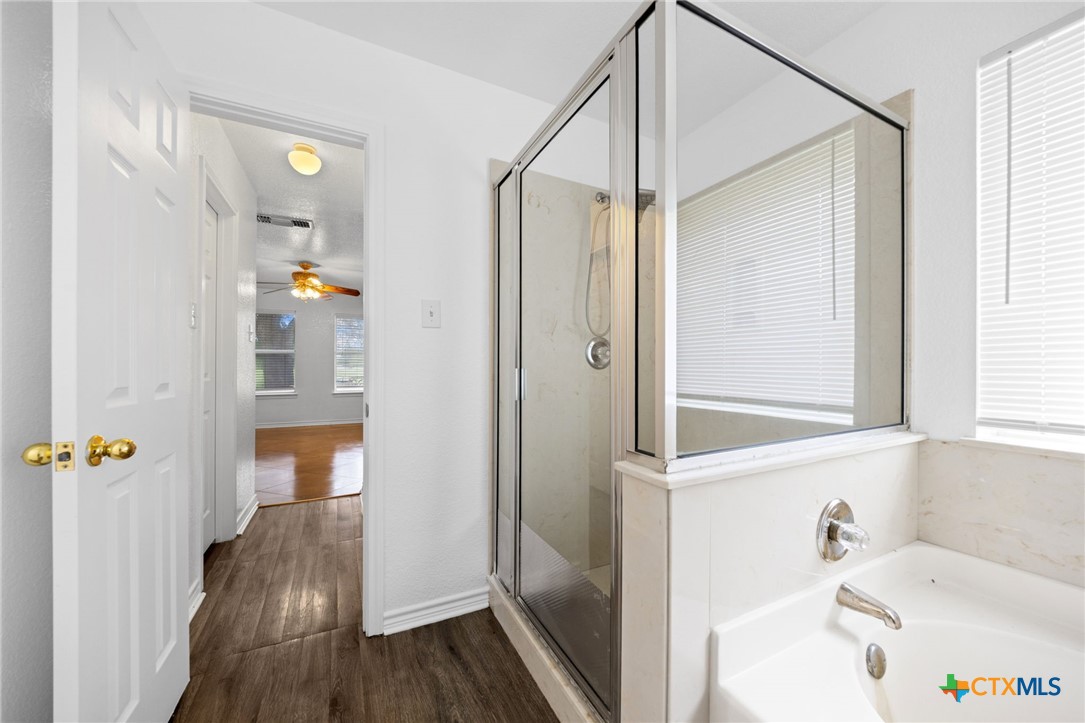 601 7 Ranch Road Salado, TX 76571 - Photo 41 of 44 a bathroom with a bathtub and a shower