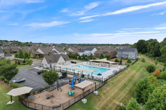 an aerial view of a house with outdoor space