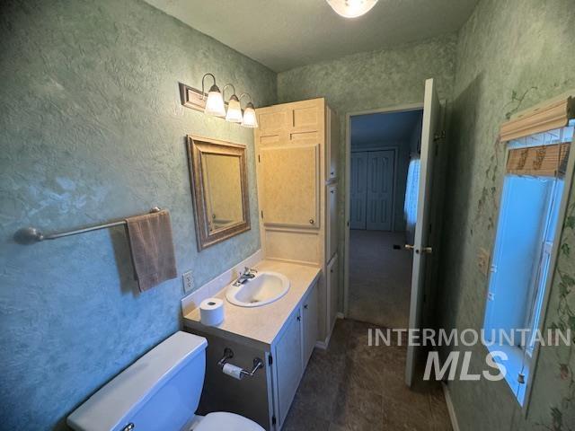 910 Moonglo, Unit 49 Buhl, ID 83316 - Photo 12 of 16 Bathroom featuring vanity and toilet