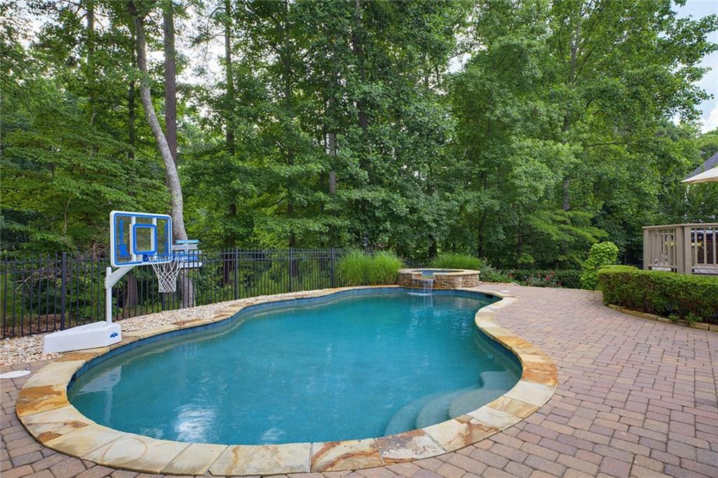 14442 Club Circle Milton, GA 30004 - Photo 60 of 82 a view of a swimming pool with a yard