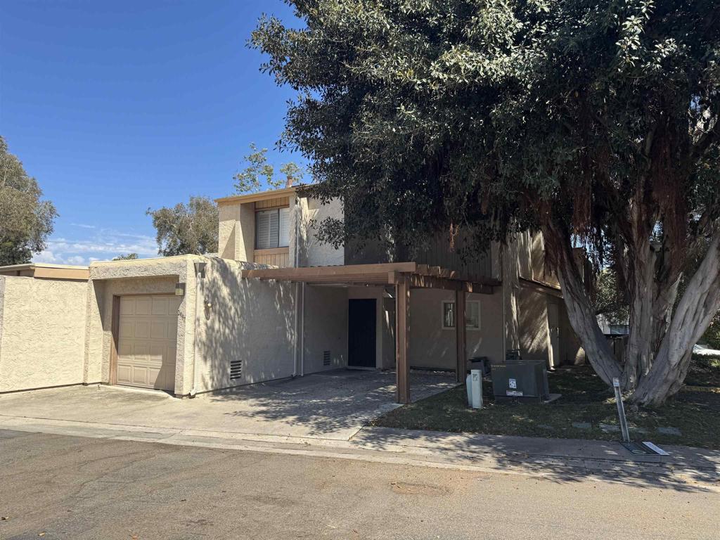 2997 Plaza Leonardo Bonita, CA 91902 - Photo 18 of 18 a view of a house with a yard and large tree