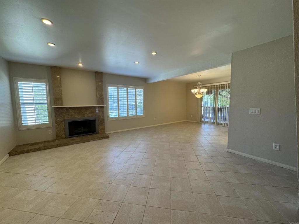 2997 Plaza Leonardo Bonita, CA 91902 - Photo 6 of 18 a view of an empty room with a fireplace and a window