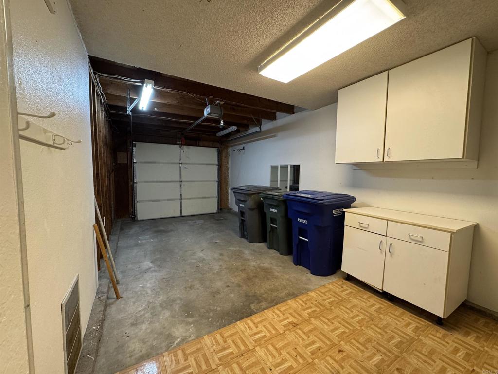 2997 Plaza Leonardo Bonita, CA 91902 - Photo 8 of 18 a kitchen with a refrigerator and cabinets
