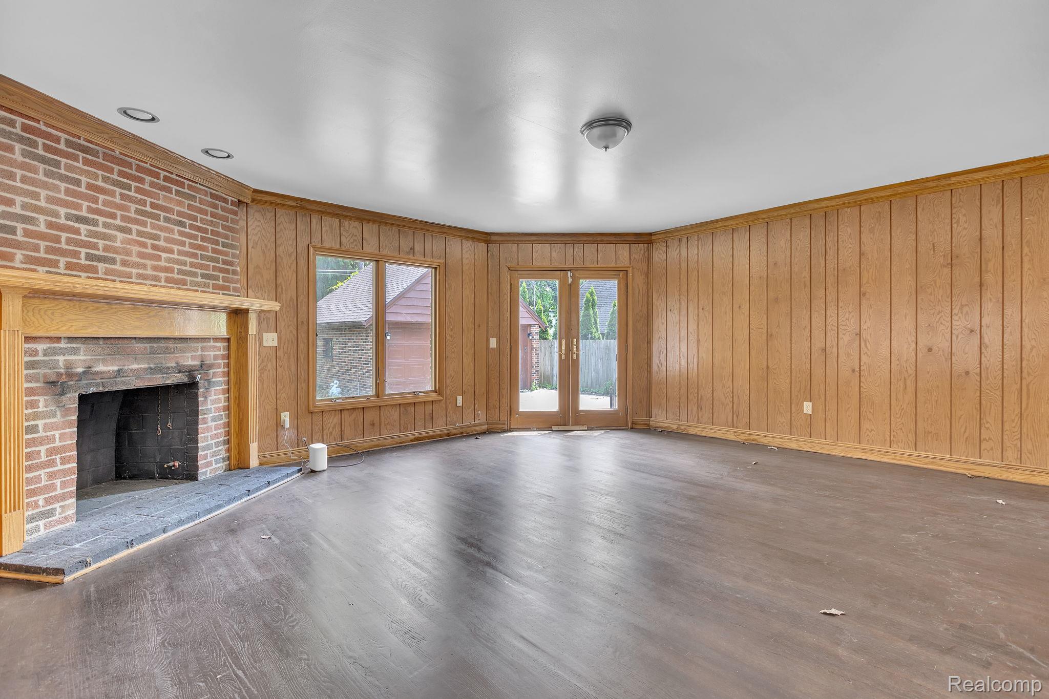 19510 Stratford Road Detroit, MI 48221 - Photo 15 of 45 Spacious room featuring wood-finish flooring and extensive wood paneling