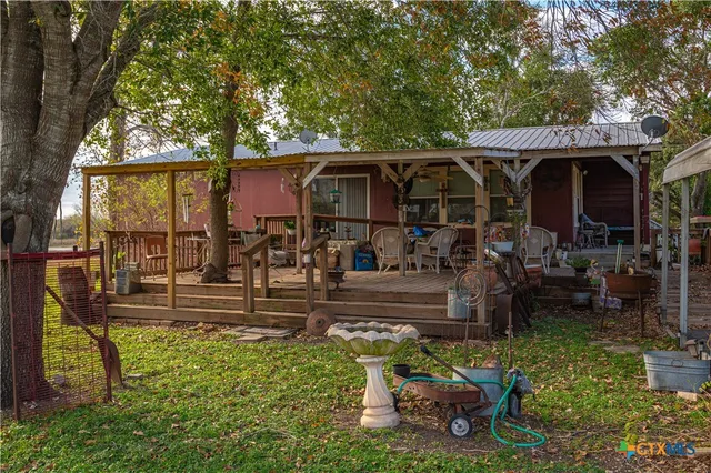 a view of a chairs and tables in the patio and a fountain