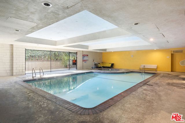 a view of a kitchen with a large window