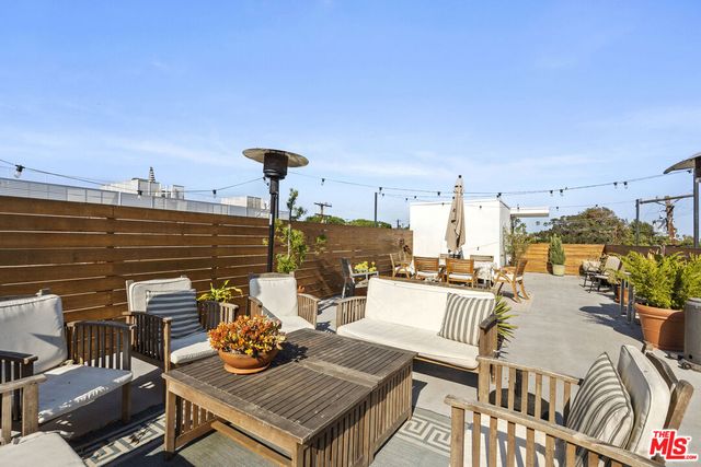 a view of a terrace with seating area