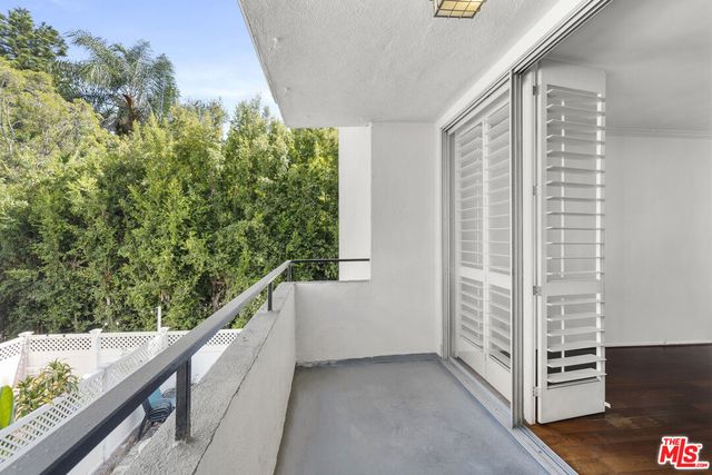 a view of a balcony with an outdoor space