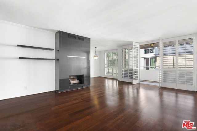 a view of a livingroom with wooden floor