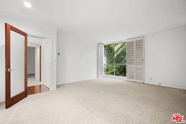 a view of a room with a large window