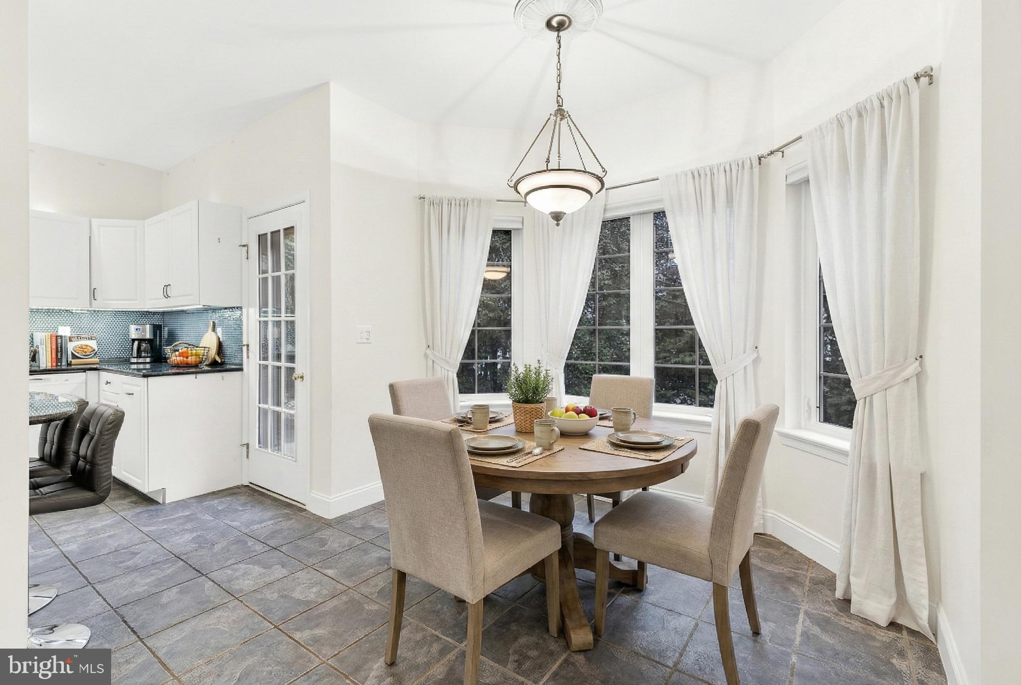 701 Woodfield Drive Lititz, PA 17543 - Photo 14 of 45 a view of a dining room with furniture window and outside view