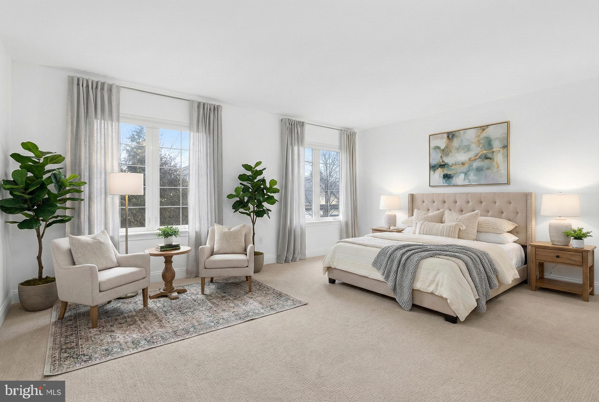 701 Woodfield Drive Lititz, PA 17543 - Photo 23 of 45 a spacious bedroom with a bed and a couch