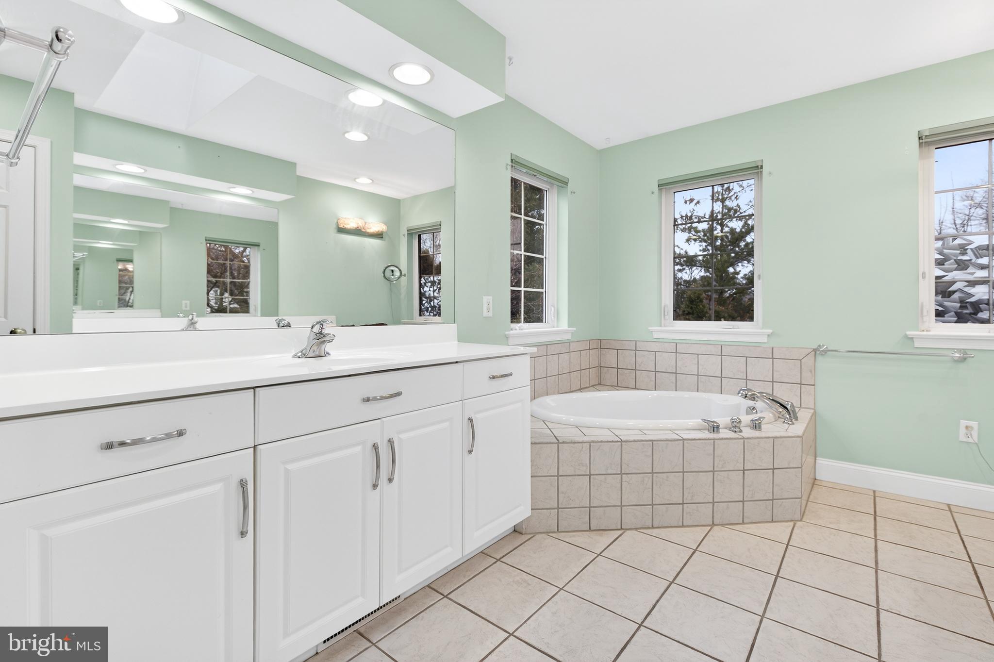 701 Woodfield Drive Lititz, PA 17543 - Photo 27 of 45 a spacious bathroom with a double vanity sink mirror and bathtub
