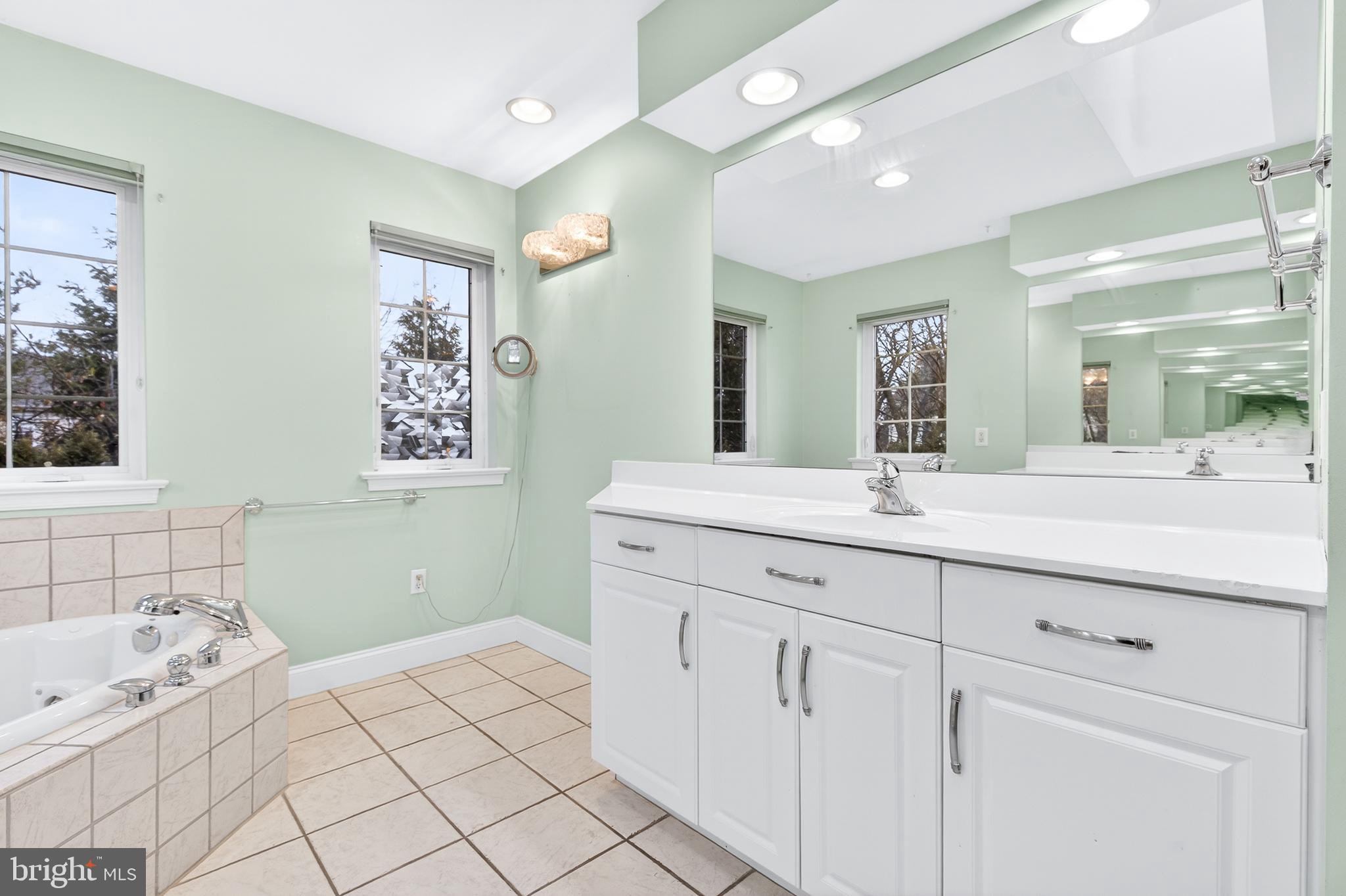 701 Woodfield Drive Lititz, PA 17543 - Photo 28 of 45 a bathroom with a sink mirror and vanity