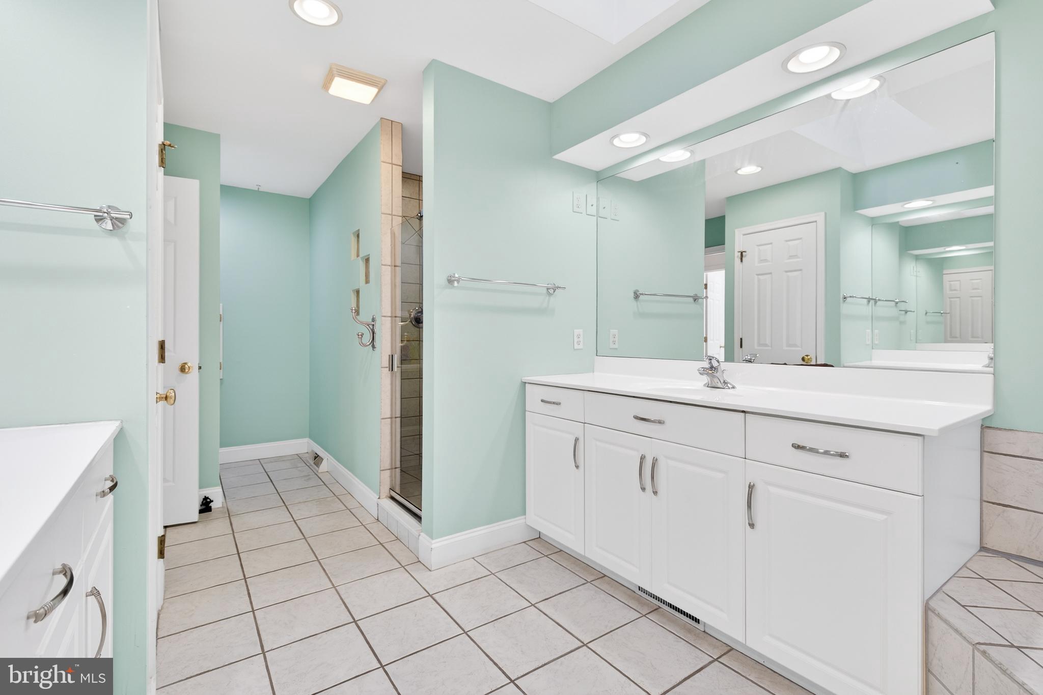 701 Woodfield Drive Lititz, PA 17543 - Photo 29 of 45 a spacious bathroom with a granite countertop sink mirror and a