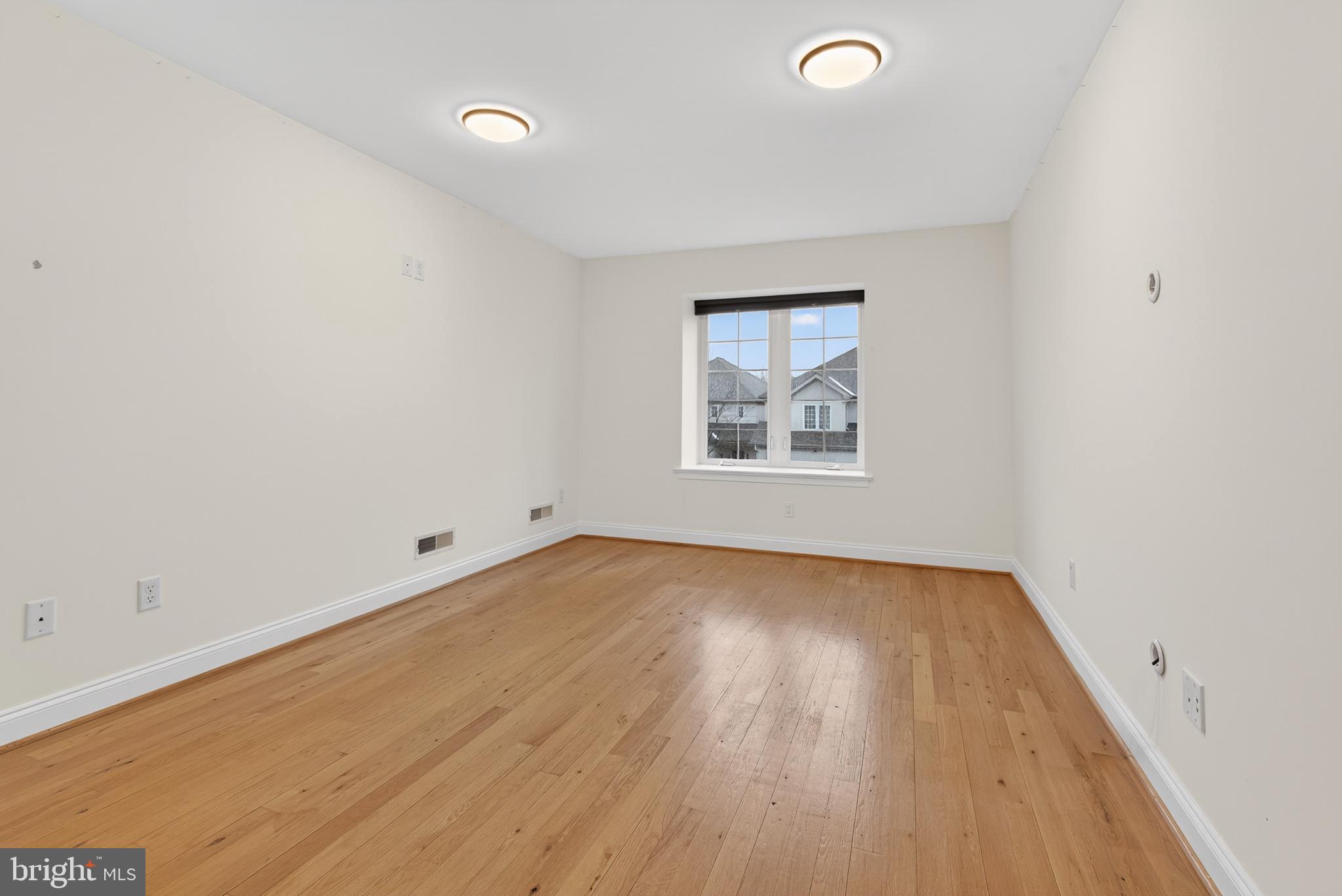 701 Woodfield Drive Lititz, PA 17543 - Photo 31 of 45 an empty room with a workspace and a window