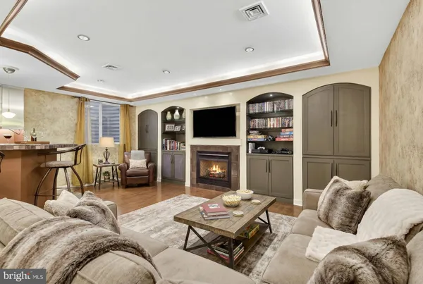a view of a livingroom with a fireplace and window