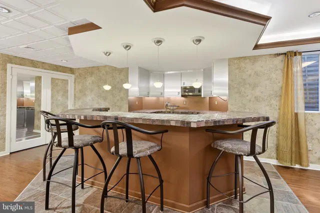 a kitchen with a table and chairs in it