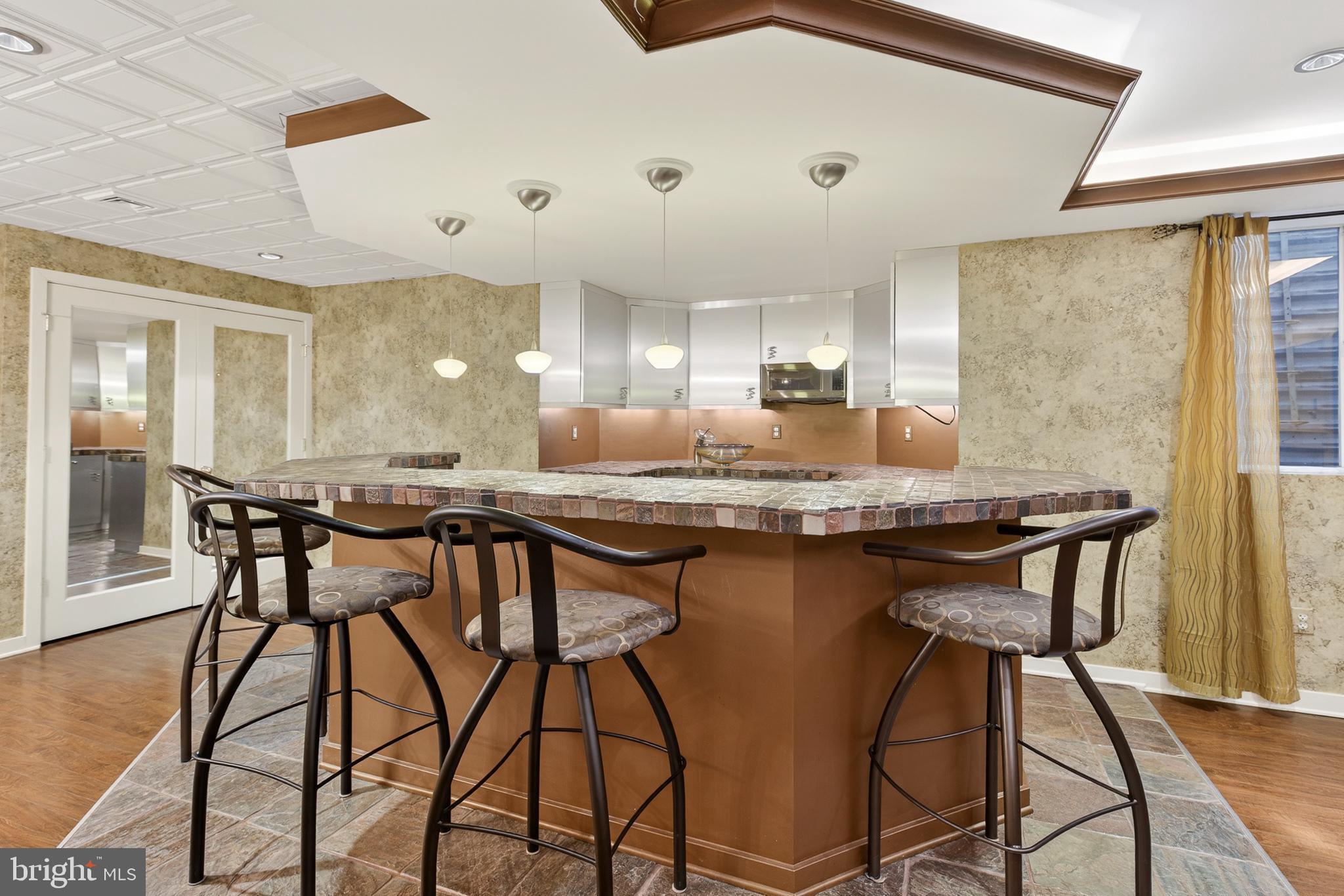 701 Woodfield Drive Lititz, PA 17543 - Photo 40 of 45 a kitchen with a table and chairs in it