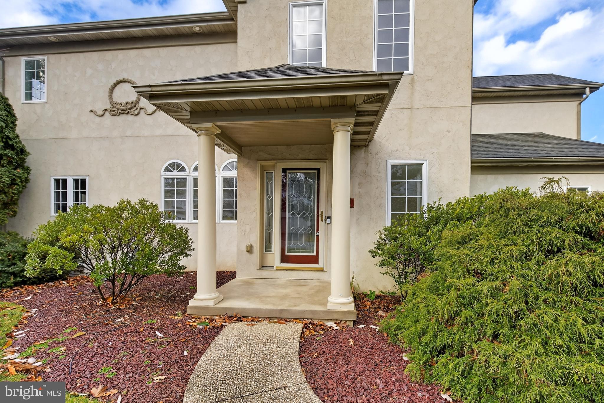701 Woodfield Drive Lititz, PA 17543 - Photo 4 of 45 a front view of a house with garden
