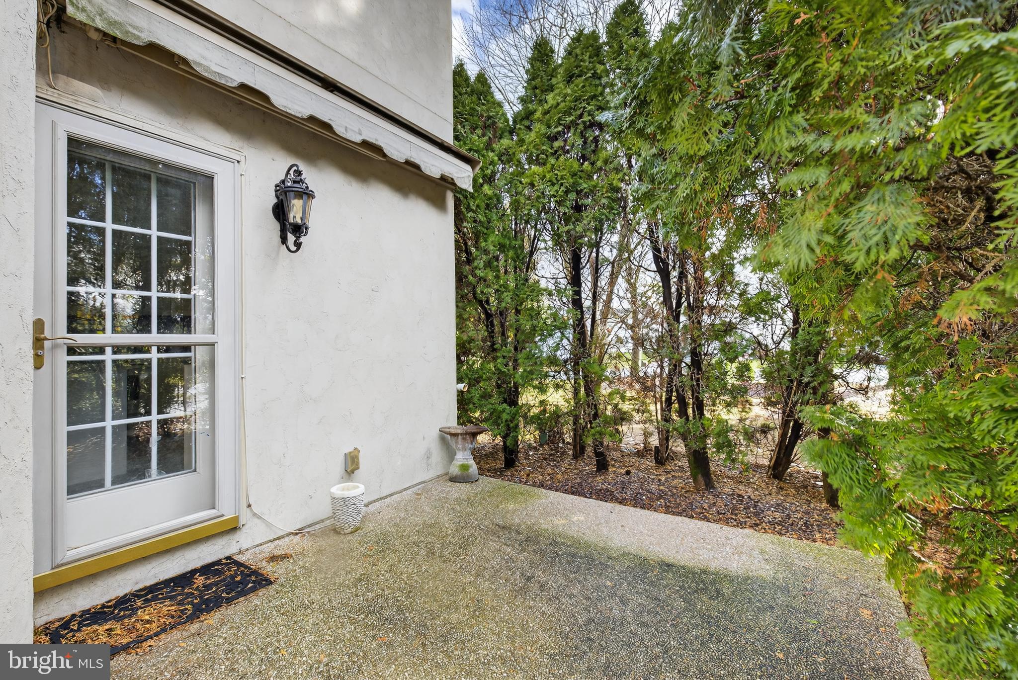 701 Woodfield Drive Lititz, PA 17543 - Photo 45 of 45 a backyard of a house with large trees and plants