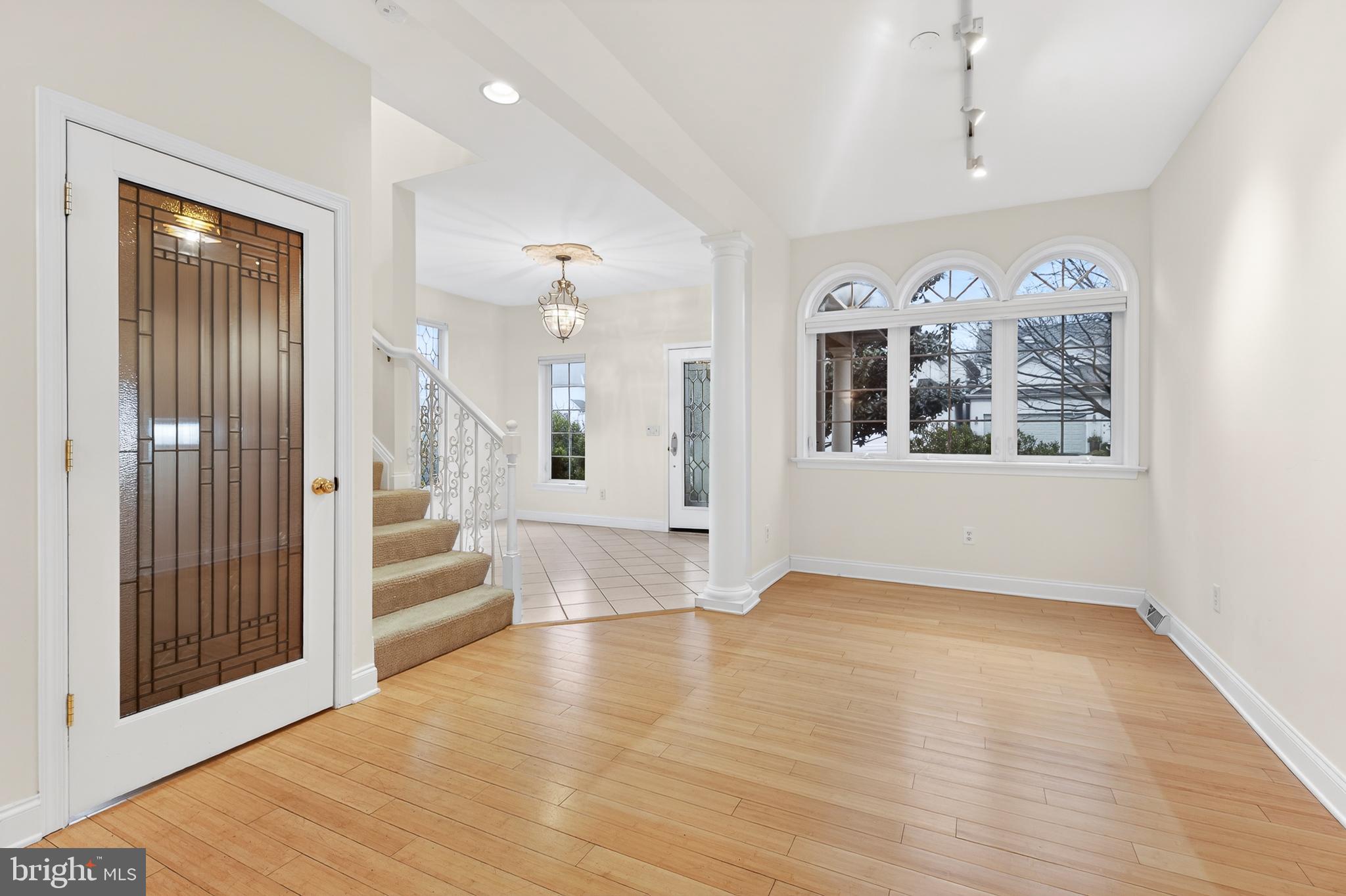 701 Woodfield Drive Lititz, PA 17543 - Photo 9 of 45 a view of a big room with wooden floor and windows