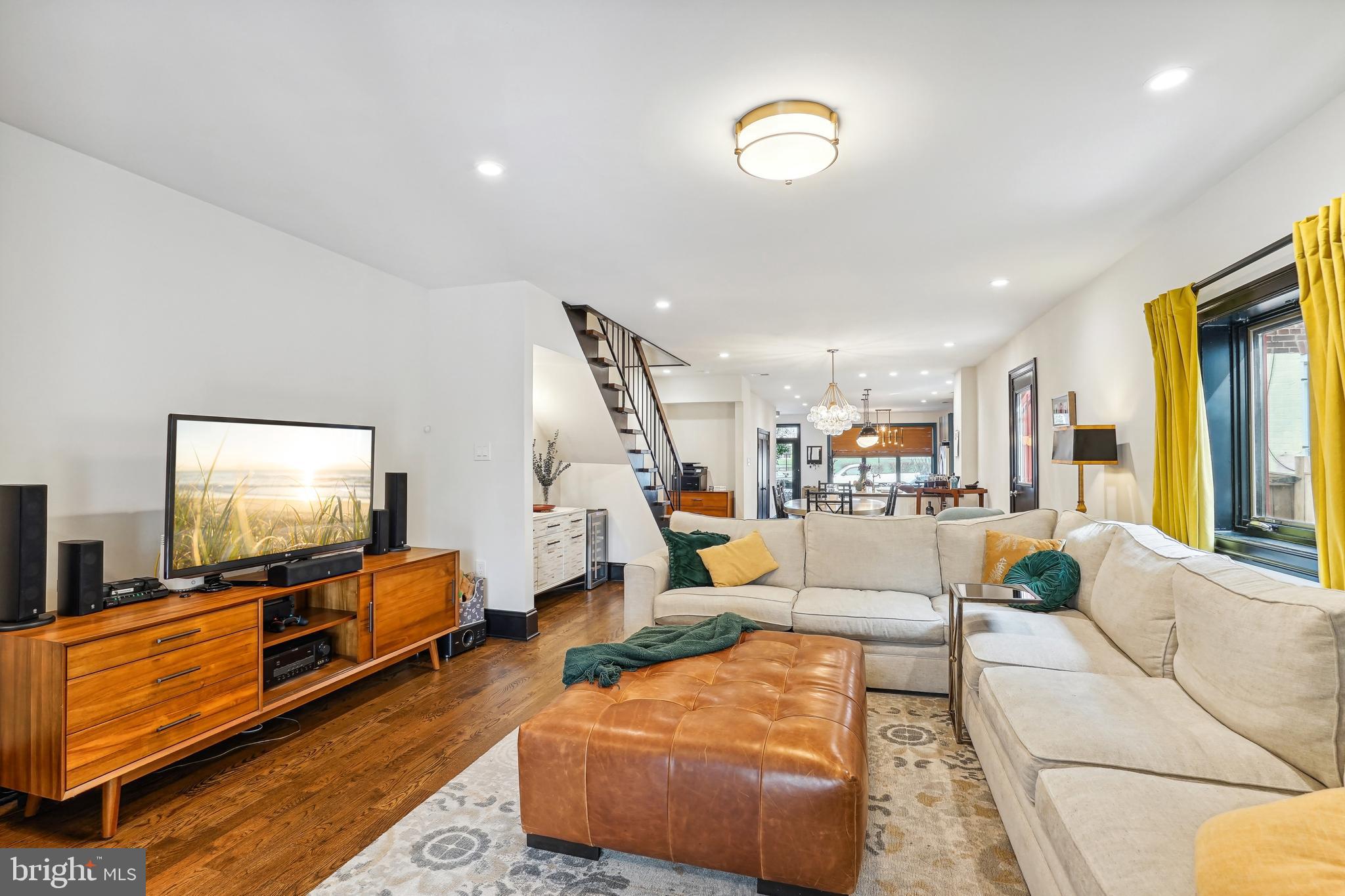 1235 E Street Southeast Washington, DC 20003 - Photo 11 of 43 a living room with furniture and a flat screen tv