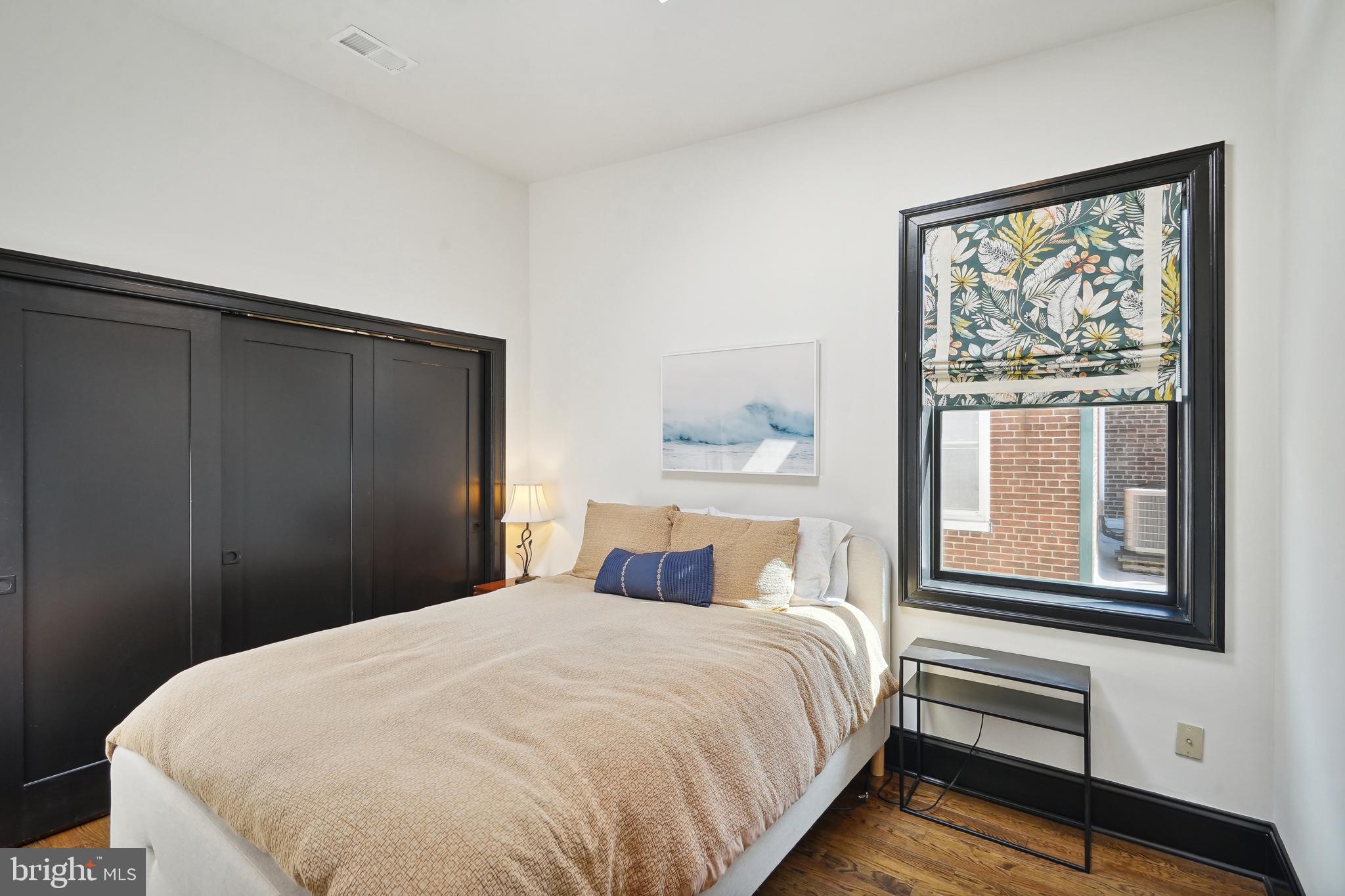 1235 E Street Southeast Washington, DC 20003 - Photo 19 of 43 a bedroom with a bed and a window