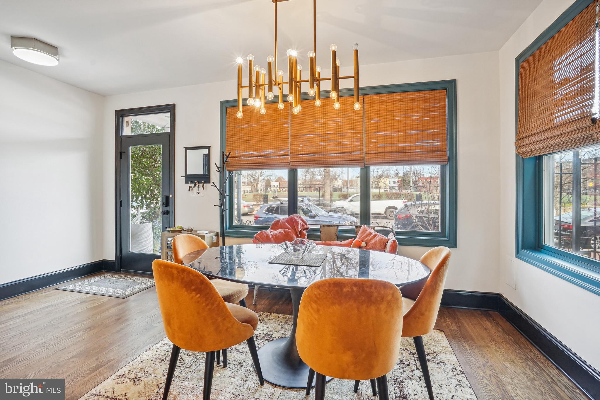 1235 E Street Southeast Washington, DC 20003 - Photo 2 of 43 a dining room with furniture a chandelier and wooden floor