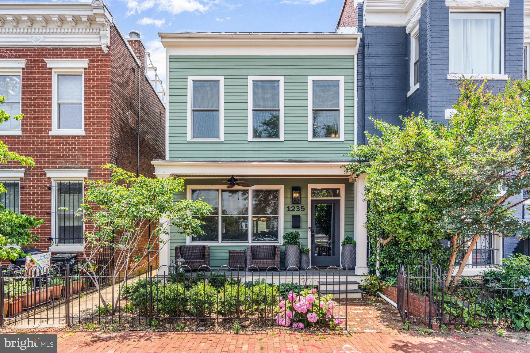 1235 E Street Southeast Washington, DC 20003 - Photo 27 of 43 a house with potted plant in front of it