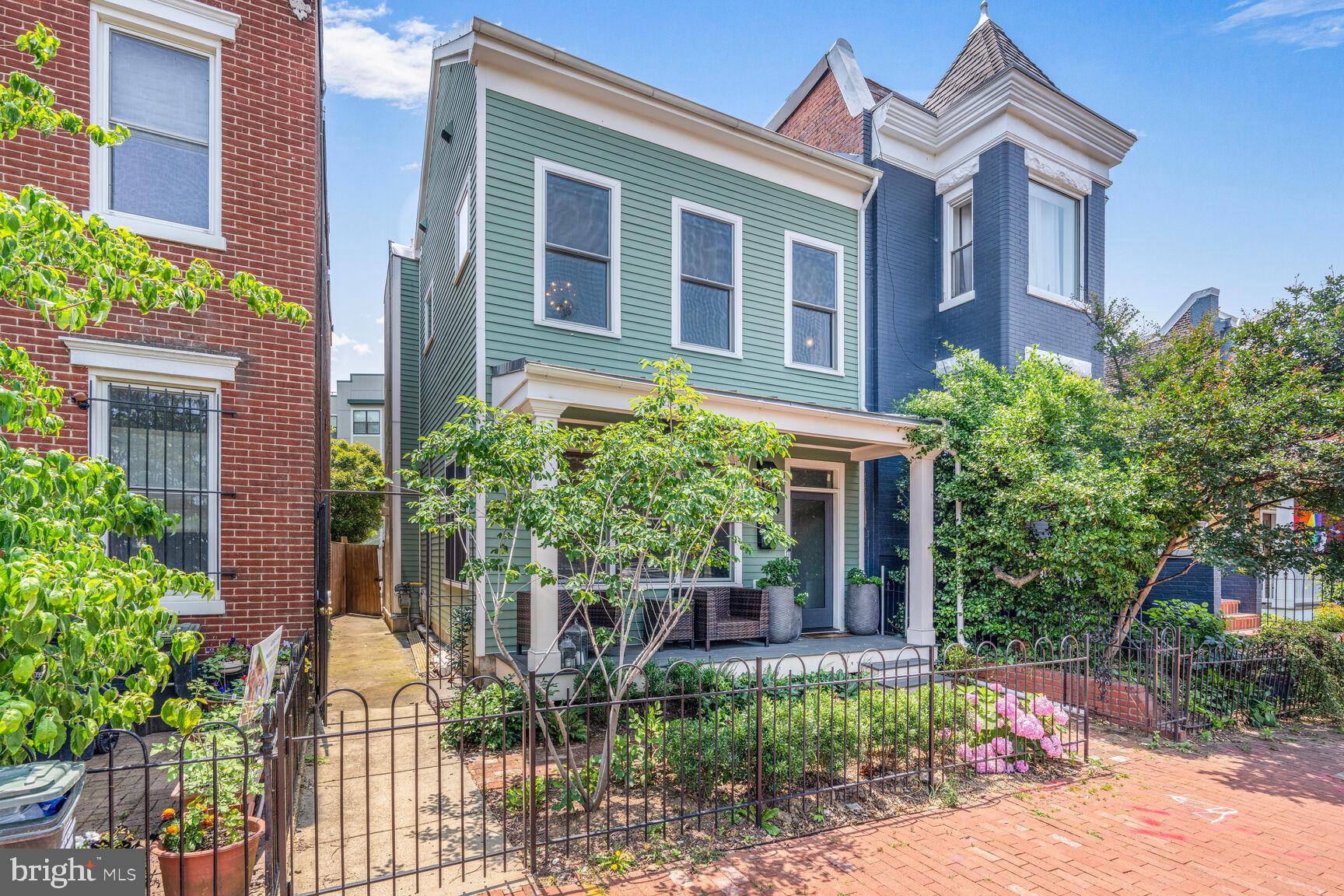 1235 E Street Southeast Washington, DC 20003 - Photo 28 of 43 a front view of a house with a yard