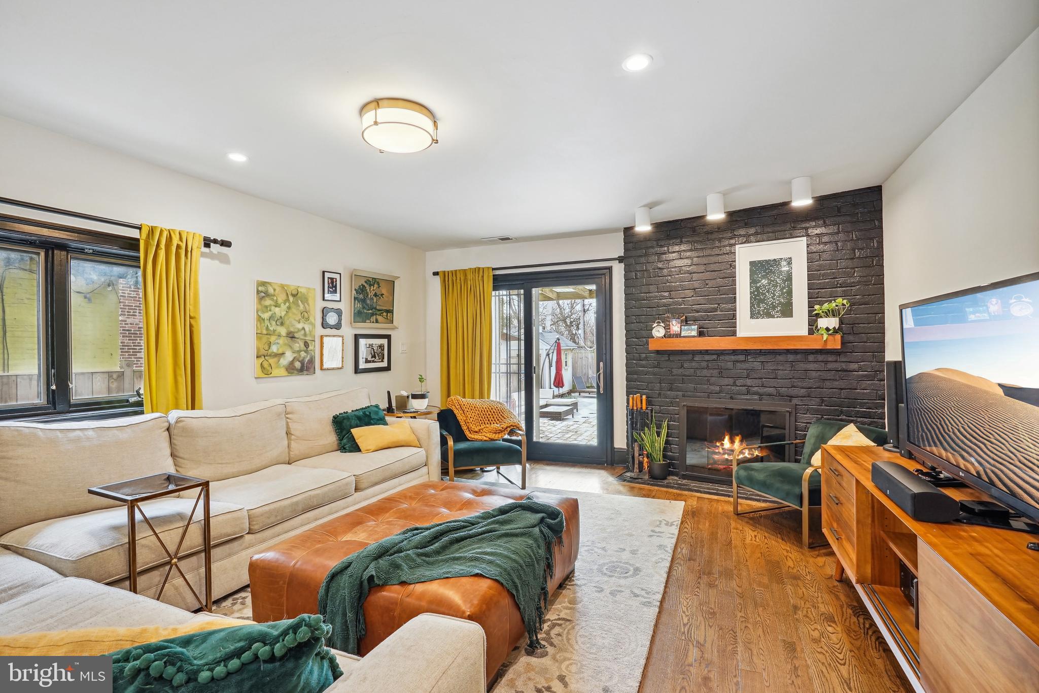 1235 E Street Southeast Washington, DC 20003 - Photo 10 of 43 a spacious bedroom with a bed and wooden floor