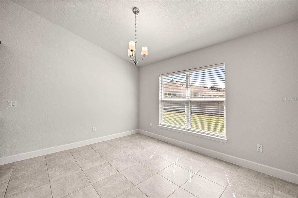 4984 Southwest 91st Place Ocala, FL 34476 - Photo 11 of 42 a view of an empty room with a window