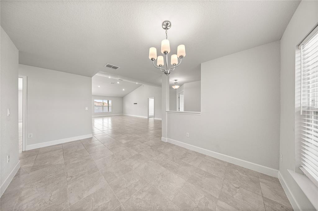 4984 Southwest 91st Place Ocala, FL 34476 - Photo 12 of 42 wooden floor in an empty room with a window