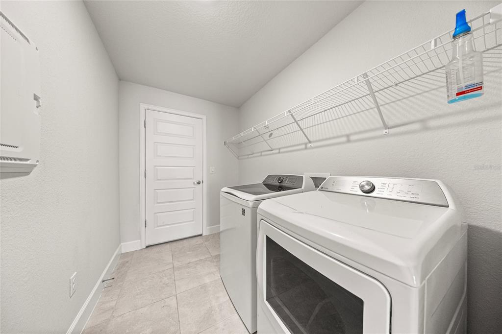 4984 Southwest 91st Place Ocala, FL 34476 - Photo 17 of 42 a utility room with dryer and washer