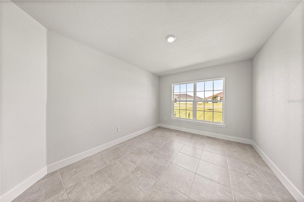 4984 Southwest 91st Place Ocala, FL 34476 - Photo 19 of 42 an empty room with a window