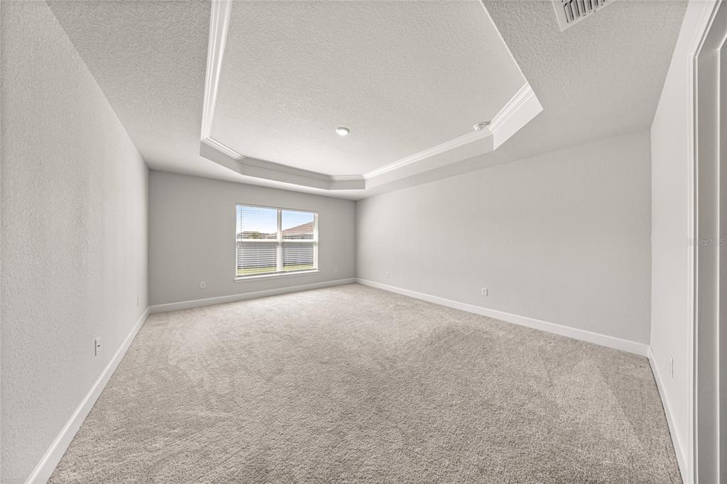 4984 Southwest 91st Place Ocala, FL 34476 - Photo 21 of 42 an empty room with windows and closet