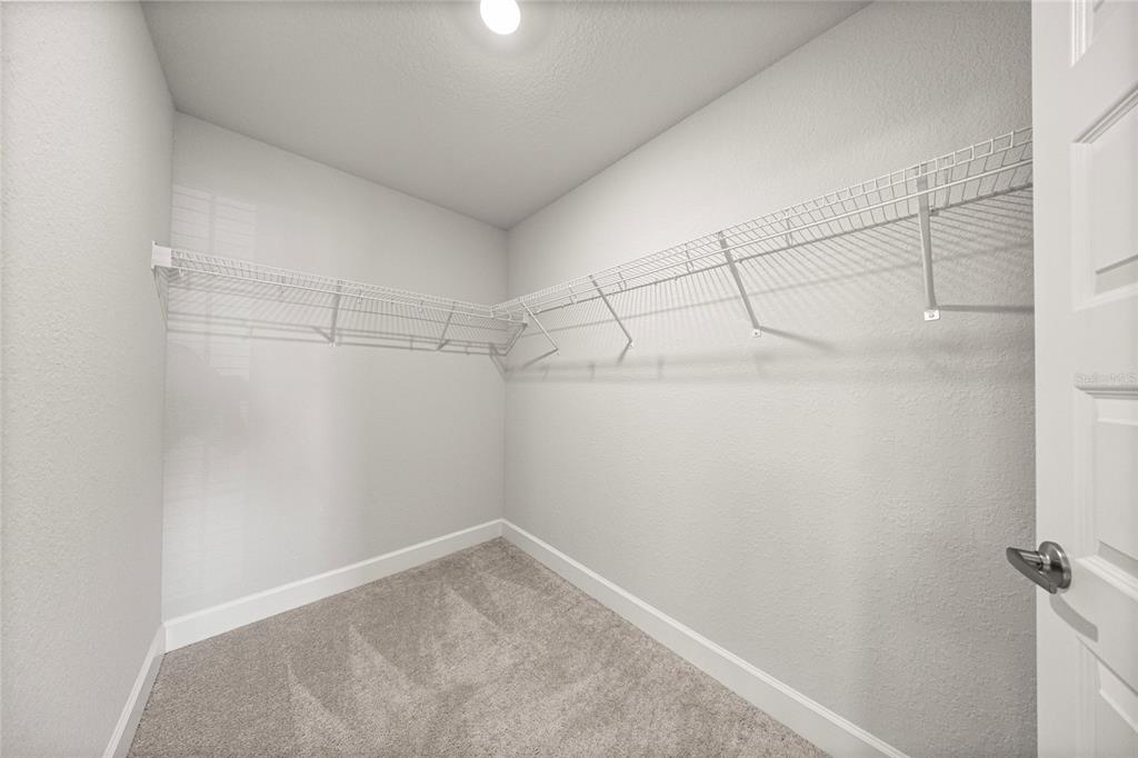 4984 Southwest 91st Place Ocala, FL 34476 - Photo 25 of 42 a view of a room with racks on the wall