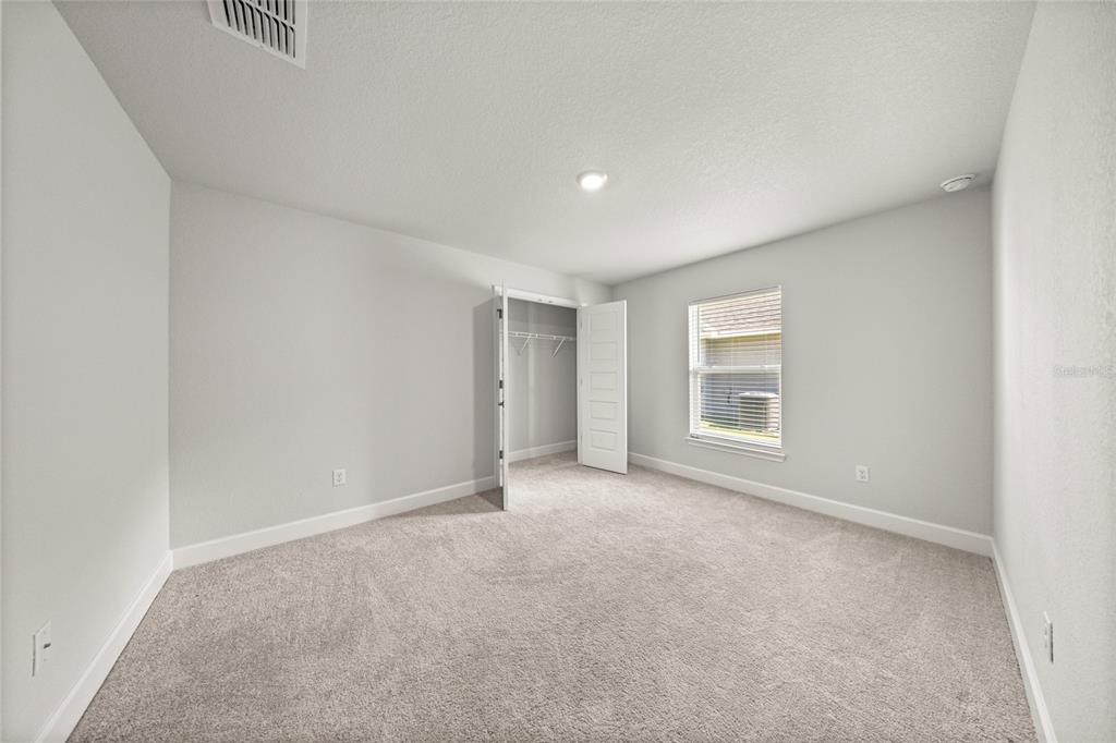 4984 Southwest 91st Place Ocala, FL 34476 - Photo 26 of 42 a view of an empty room with a window
