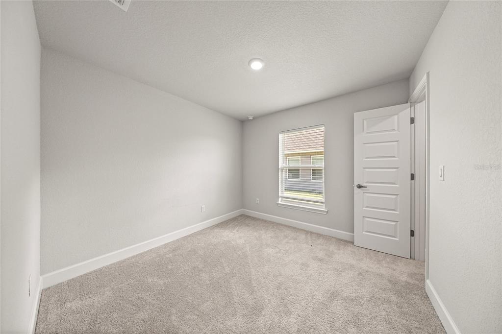 4984 Southwest 91st Place Ocala, FL 34476 - Photo 29 of 42 an empty room with a window