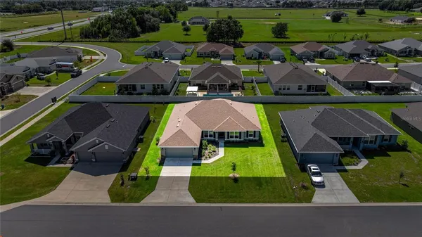 an aerial view of a house with a garden