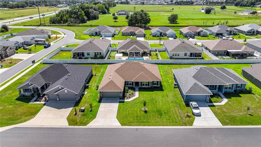 4984 Southwest 91st Place Ocala, FL 34476 - Photo 38 of 42 an aerial view of multiple houses with yard
